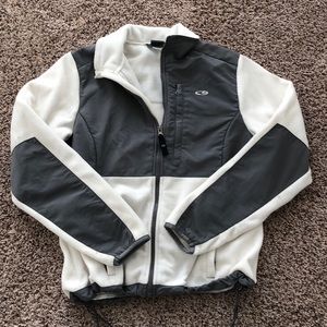 White/Grey zipped jacket.